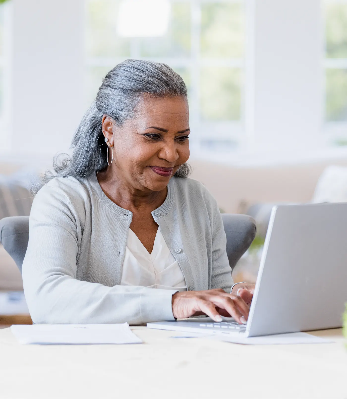 Photo of senior woman using her laptop.